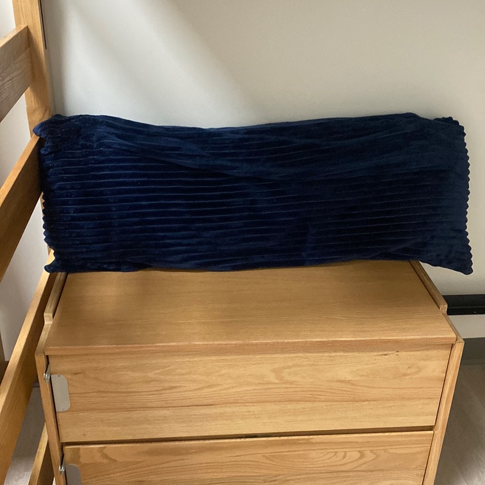 Navy blue body pillow.